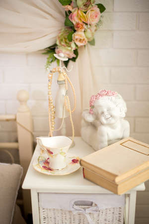 Beautiful interior, book, coffee Cup, angel, photo zoneの写真素材