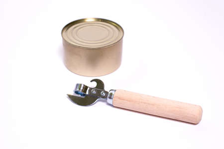vintage bottle opener with wooden handle and tin can on white background with space for textの写真素材