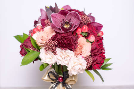beautiful floral arrangement, on shabby white wooden table with space for textの写真素材
