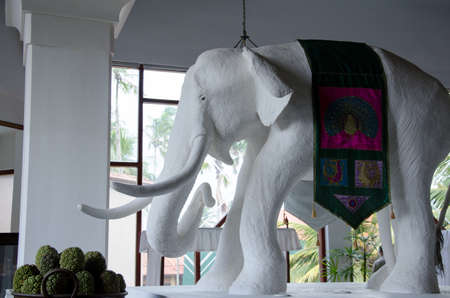 Statue of a white elephant in Asia with a peacock patternの写真素材