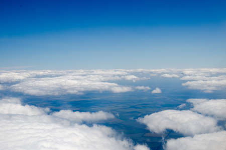 Clouds and sky as seen through window of an aircraft.の写真素材