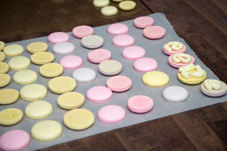 cooking, confectionery and baking concept - macarons on table.の写真素材