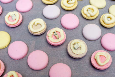 cooking, confectionery and baking concept - macarons on table.の写真素材