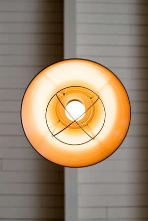 a unique lamp housing inside a coffee shop from below.の写真素材