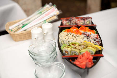 Various kind of sushi food served on boat capacity.Different Types of Maki Sushi and Nigiri Sushiの写真素材
