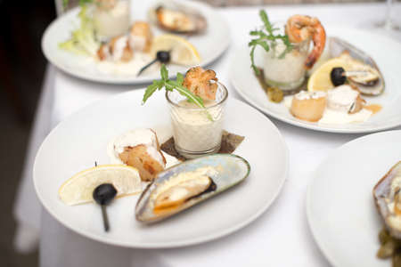 Seafood sets at local restaurant, fine dining, Fresh seafood platter with , mussels and on plate with tartar sauce.の写真素材