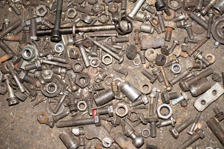 Closeup of steel screws and bolts background.の写真素材