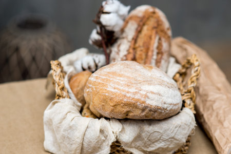 Composition with variety of baking products in the basket on the table