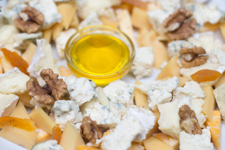Tasty appetizer. Plate of Cheese on white plate at a restaurant