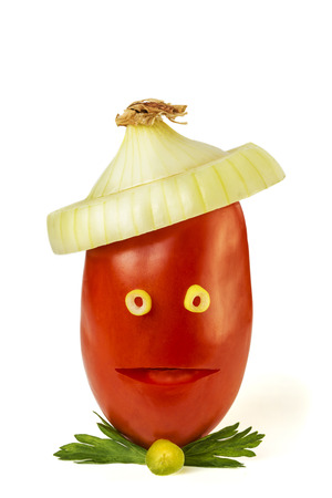 Tomato face with an onion hatの写真素材