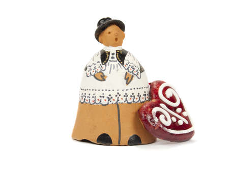 Clay figures in Serbian national costume on white backgroundの写真素材