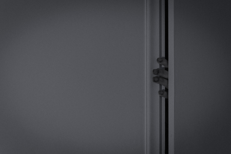 scary fingers from a door gapの写真素材