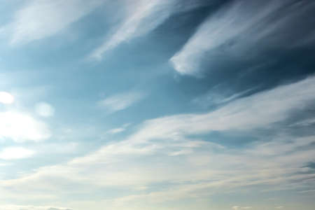 Clouds in the blue sky on a bright cloudy dayの写真素材
