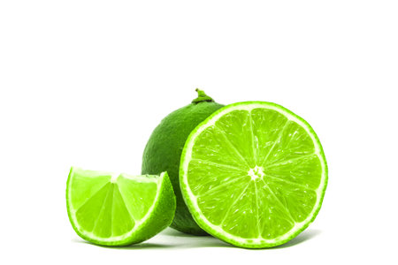 sliced group of green fresh lime on white background isolated. High quality stock photoの写真素材