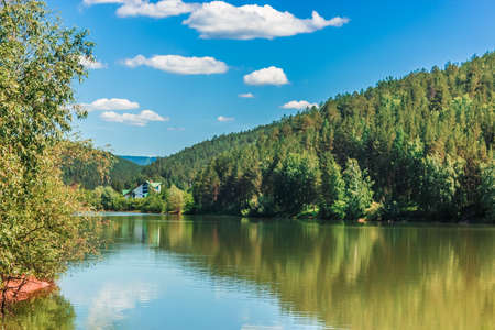 Beautiful lake with forest mountains in the background. High quality photoの写真素材