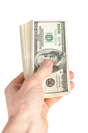 big pile of money (american dollars) in the handの写真素材