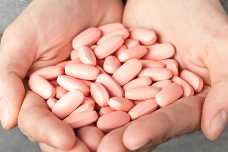 many pills in the hands. medicine conceptの写真素材