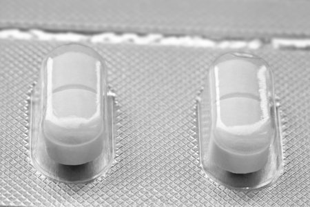 Medicine concepts. Macro picture of capsule pills in the plateの写真素材