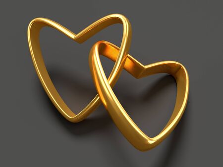 Two connected gold wedding hearts over blackの写真素材