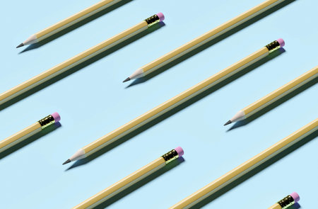 Concept of pencils with an eraser lie on a blue background. 3d renderingの写真素材