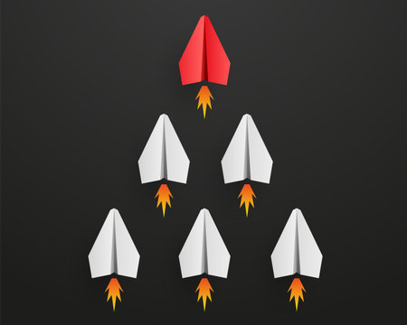 Individual red leader paper plane lead other with fire. business and leadership concept