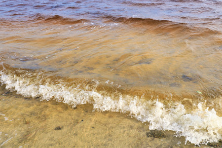 Small ocean waves splash near the coast of the Gulf of Mexico