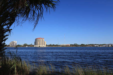 Santa Rose Island, Florida, USA - September 2020. A wonderful view with palm trees to the multi-storey hotel.のeditorial素材