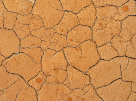 Cracked dry rough clay surface