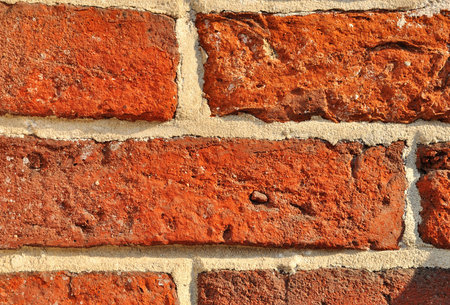 Weathered aged red brickwork wall vintage background