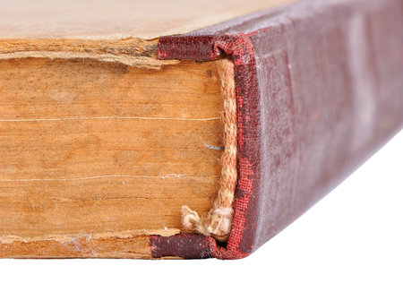 Obsolete old book isolated - focusing in foreground