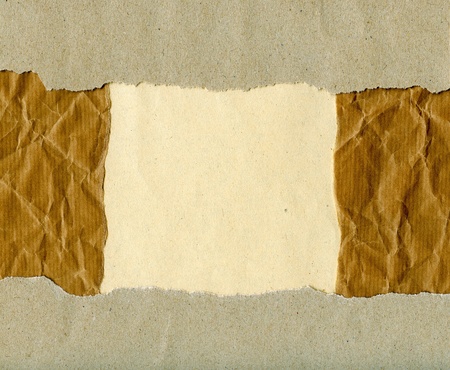 Textured torn aged paper with natural fiber partsの写真素材