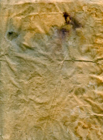 Dirty textured stained recycled retro paper with natural fiber partsの写真素材