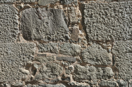 Weathered antique old cracked stone blocks wall retro background