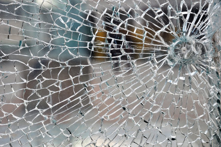 Cracked broken destroyed glass damaged window background
