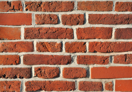 Weathered aged red bricks wall vintage background