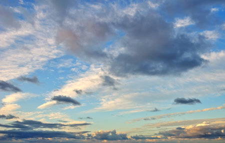 Wonderful dramatic clouds against light blue sky
