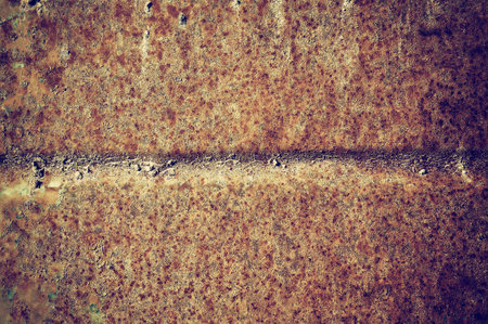 Obsolete corroded textured rusty metal surface background