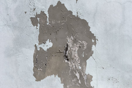 Weathered aged cracked rough stucco concrete grunge backgroundの写真素材