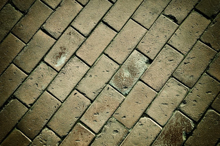 Rough textured concrete tiles walkway closeup backgroundの写真素材
