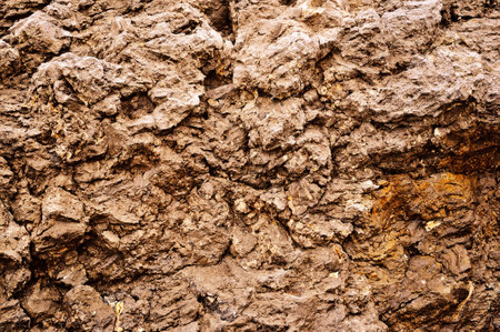 Weathered aged cracked rough stone surface backgroundの写真素材