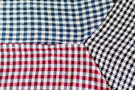 Three wool scarfs. The keffiyeh is a black, red or blue and white scarf that is usually worn around neck or headの写真素材