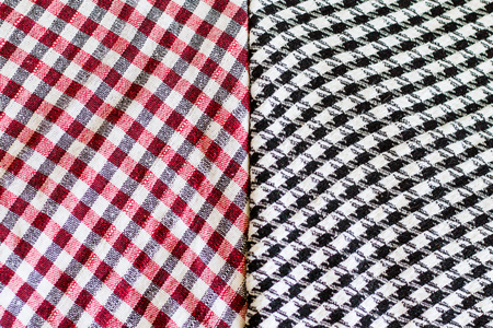 Two wool scarfs. The keffiyeh is a black, red or blue and white scarf that is usually worn around neck or headの写真素材
