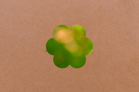 Creative layout made of green leaves with paper card note. Flat lay. Nature concept
