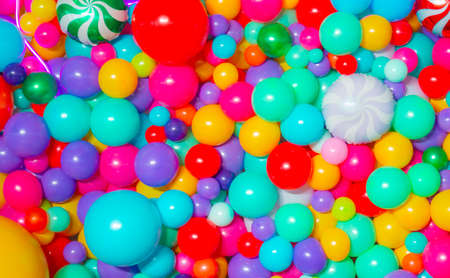 Many colorful helium balloons background for holidayの写真素材