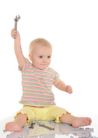 baby with tools on white backgroundの写真素材