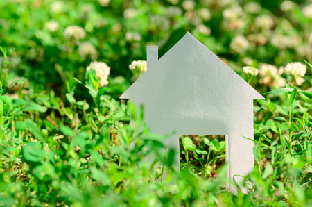 House in green fieldの写真素材