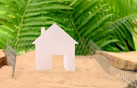 House in green fieldの写真素材