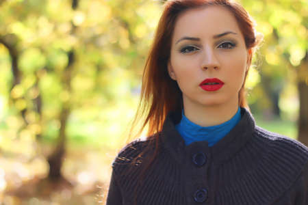 Girl autumn leaves coatの写真素材