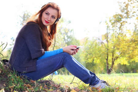 Girl autumn leaves casual playerの写真素材
