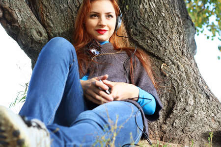 Girl autumn leaves casual playerの写真素材